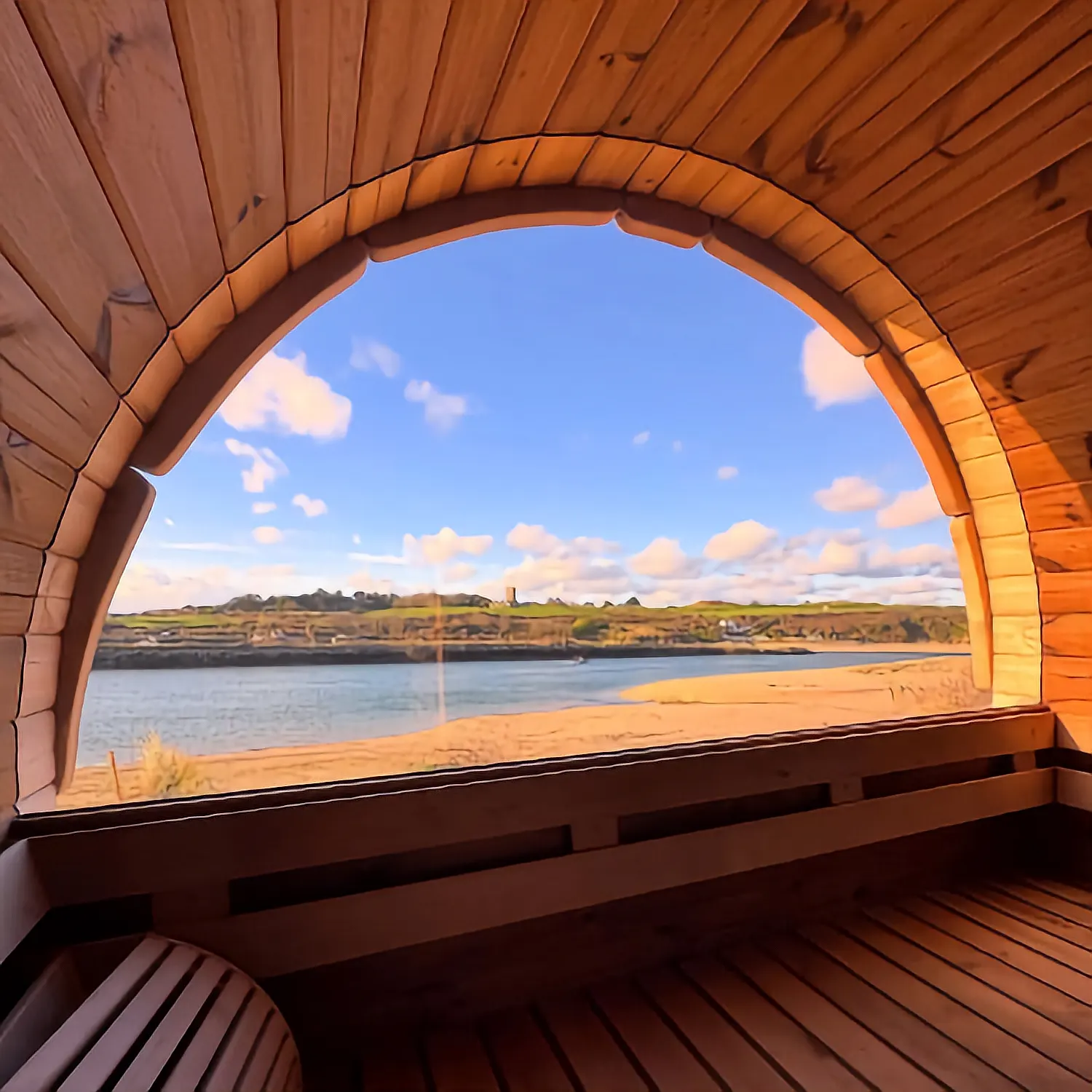 Barrel sauna interior with panoramic beach view